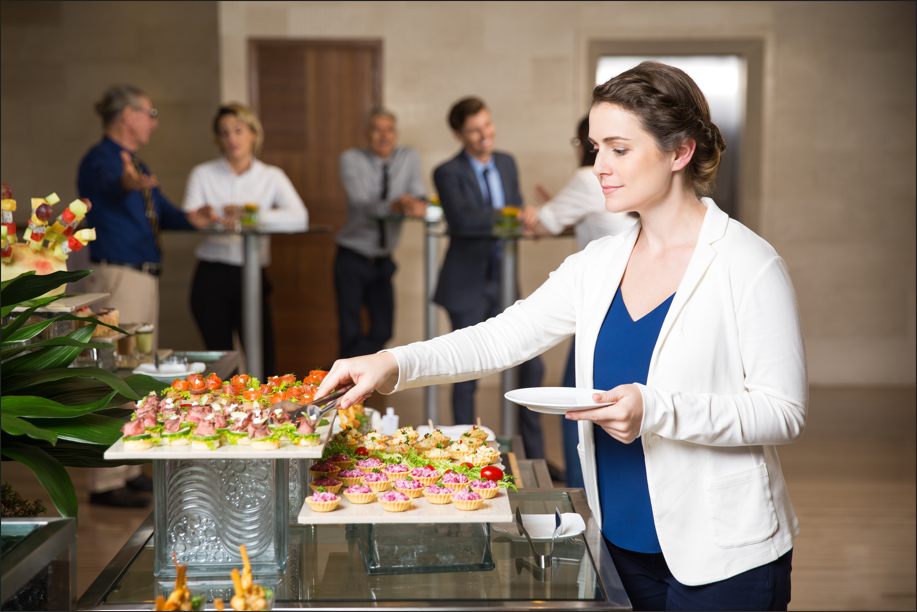 women eating in large group catering